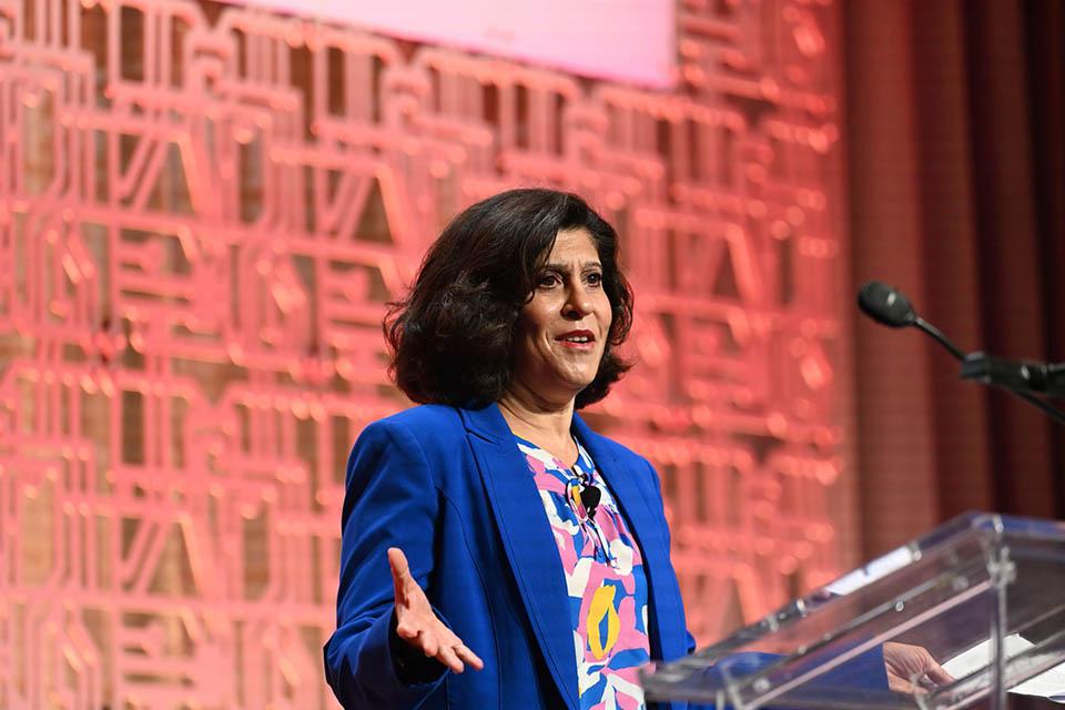 Alameh speaks at a lectern.